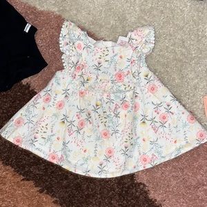 0-3 month dress. Never worn. Grew out of it before she got to wear